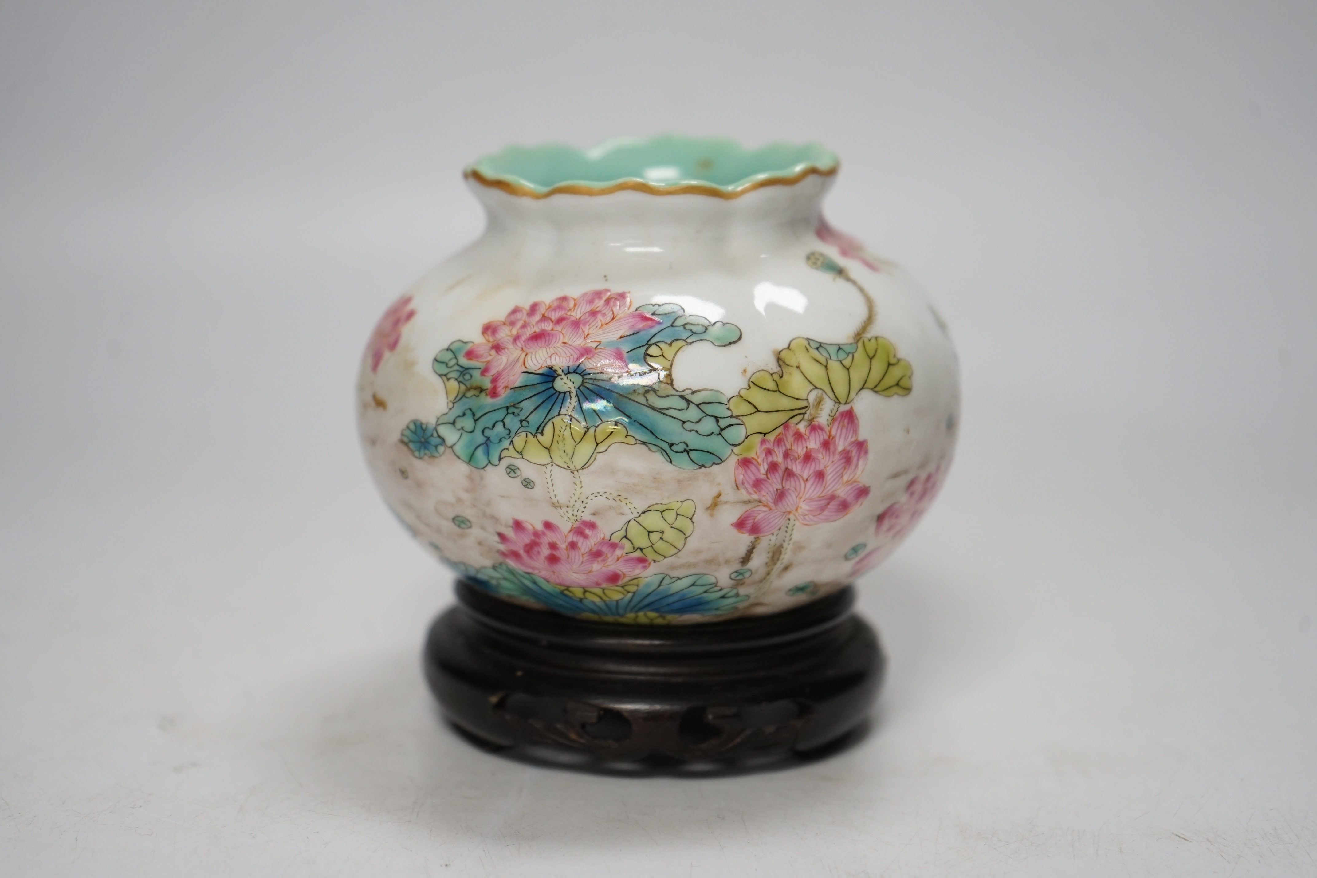 A Chinese famille rose water pot, Qianlong mark but later, on hardwood stand 9cm